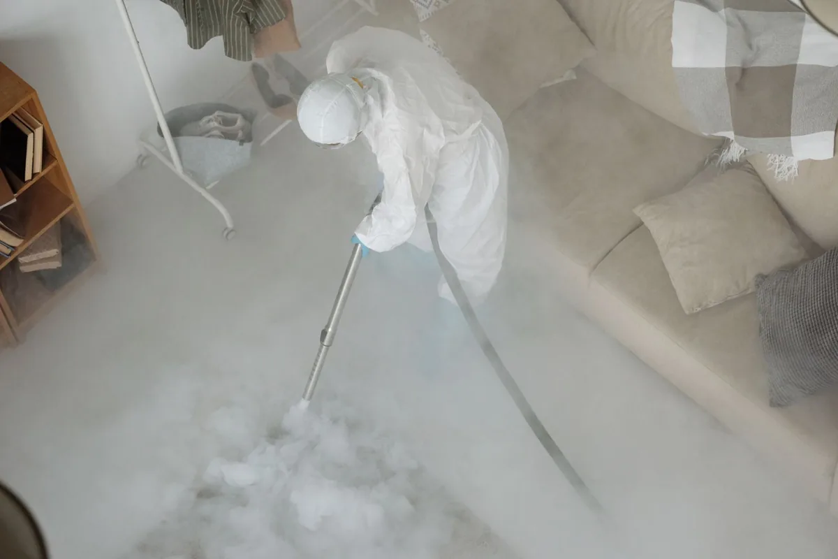 Biohazard cleanup technician in protective equipment, Wauregan, CT